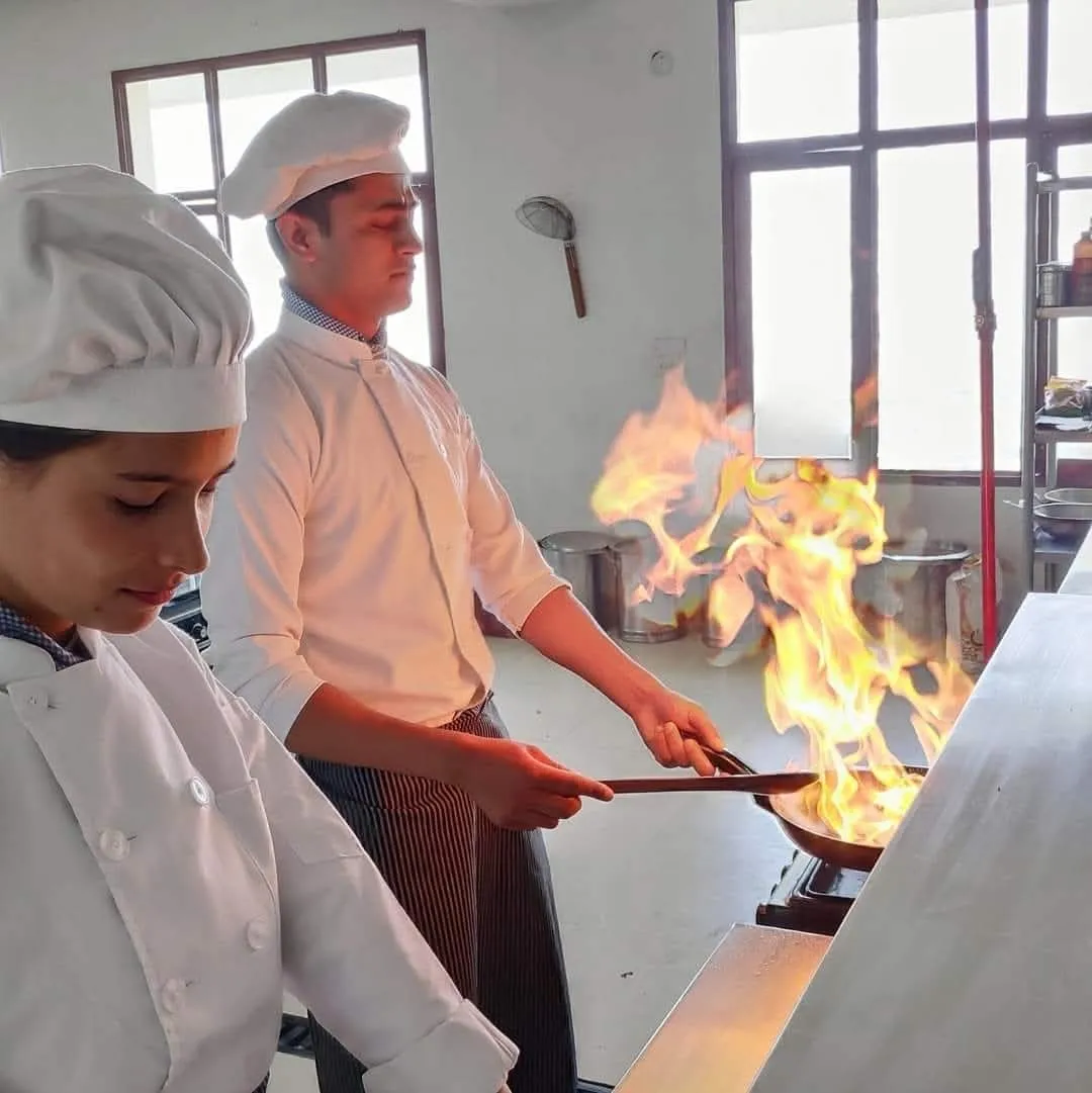 As part of the practical training curriculum, students demonstrated live cooking and flambé techniques under the guidance of experienced faculty. The session focused on developing culinary expertise, precision, creativity, and confidence while emphasizing food safety, presentation, and professional kitchen practices. This hands-on experience enabled students to refine their technical skills and gain real-world exposure to the dynamic environment of the hospitality and food service industry.